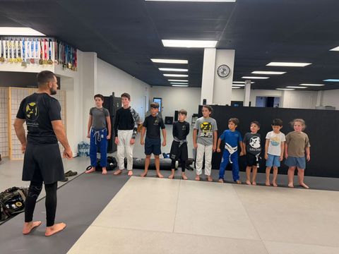Kids & Teen BJJ students lined up for a No-Gi Jiu-Jitsu class in Venice FL
