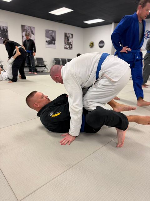 Adult students sparring during a BJJ class in Venice FL
